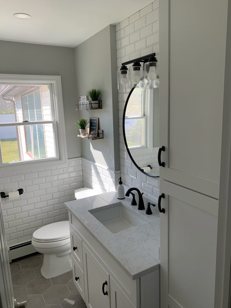 final modern farmhouse bathroom design. vanity, linen cabinet, toilet